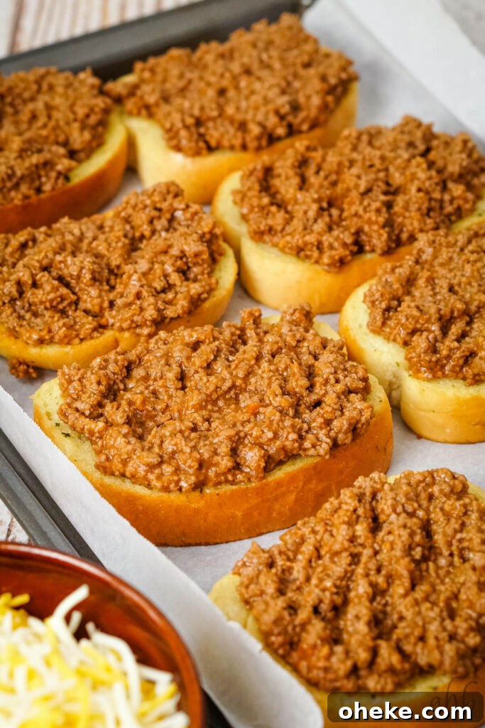Garlic Bread Sloppy Joes: Cheesy Savory Sandwich Recipe 7 A tray of freshly baked garlic bread heaped with the ground beef mixture.