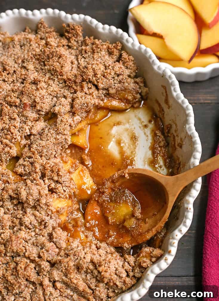 Paleo-Friendly Vegan Peach Crisp Recipe for Summer Desserts 6 vegan paleo peach crisp in a pie plate
