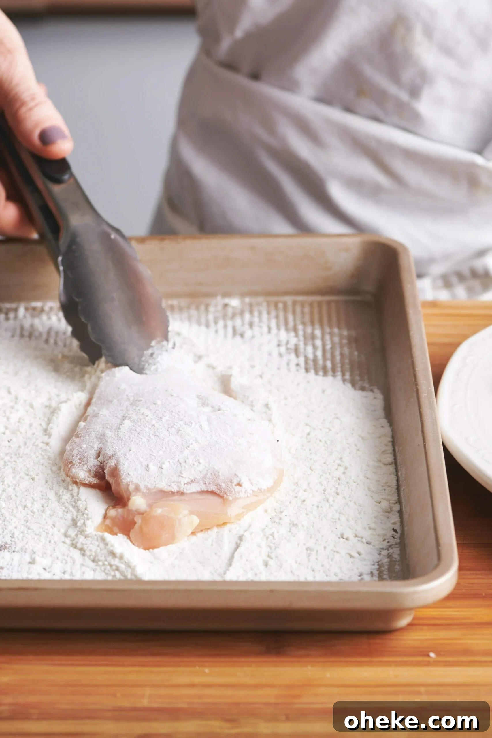How to Flour Chicken Cutlets for Perfect Crispy Coating 2 Dredging chicken in flour.