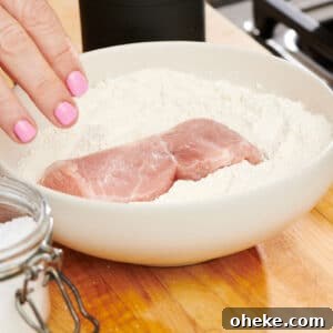 How to Flour Chicken Cutlets for Perfect Crispy Coating 9 Dredging chicken in bowl of flour.