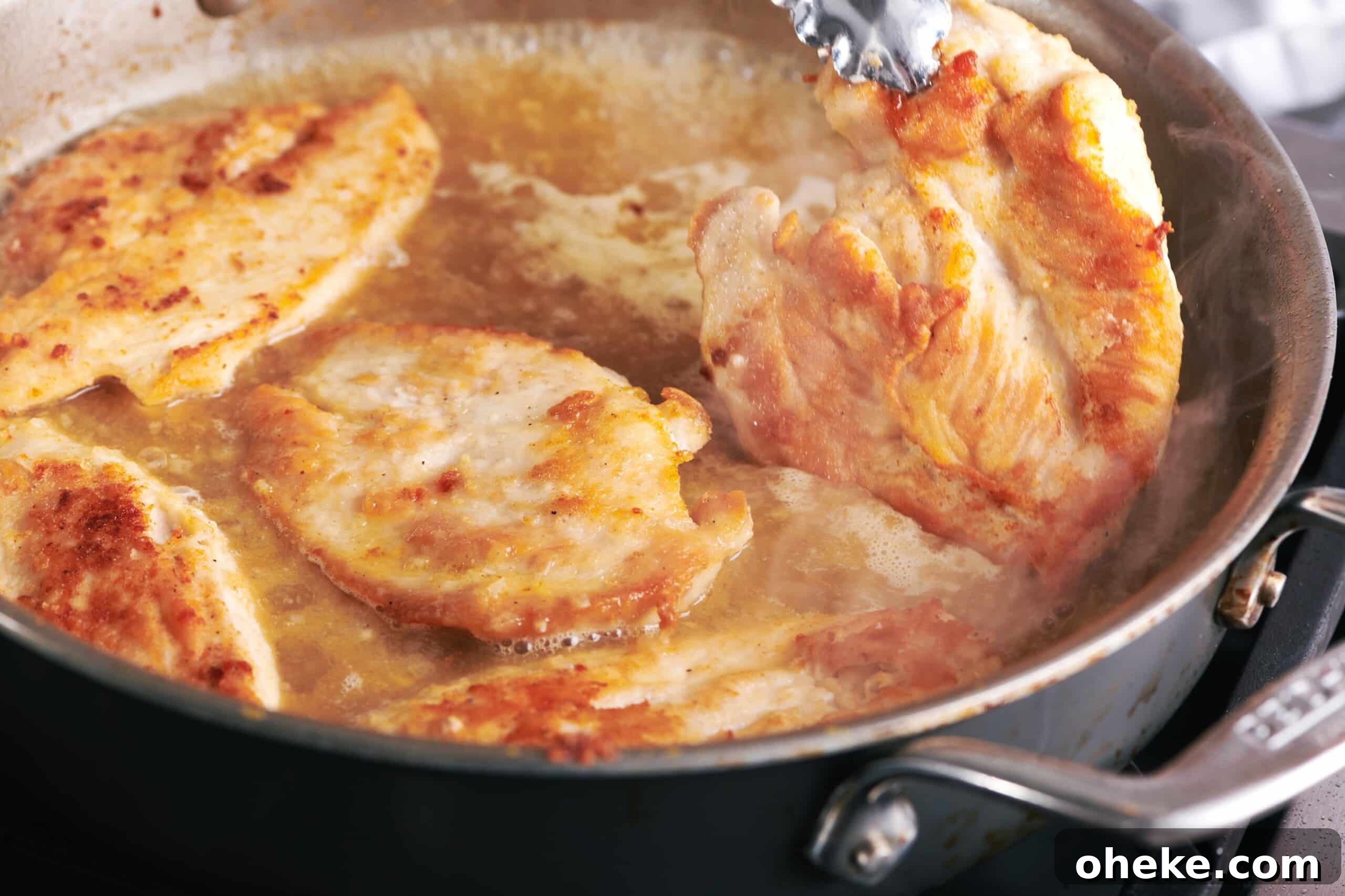How to Flour Chicken Cutlets for Perfect Crispy Coating 7 Cooking chicken cutlets in pan.