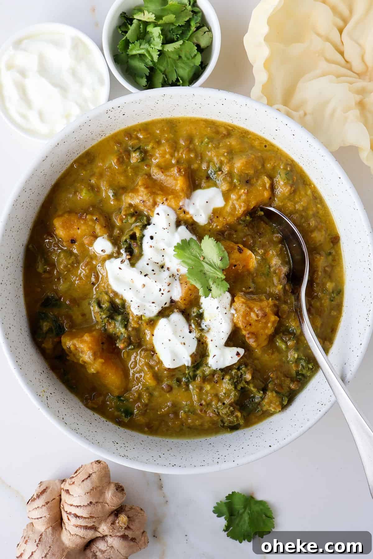 Curried Butternut Squash and Lentil Soup Recipe 10 Butternut squash soup in a bowl with a spoon.