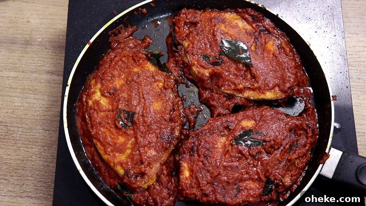fish masala fry in a tawa, ready to serve.