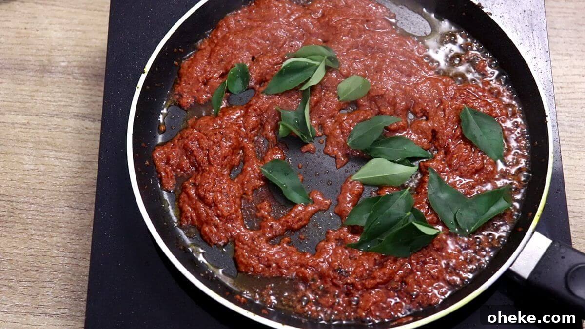 addition of curry leaves to fish fry masala.