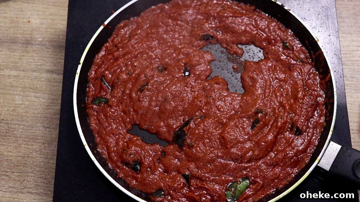 masala leaving oil from the sides on the tawa.