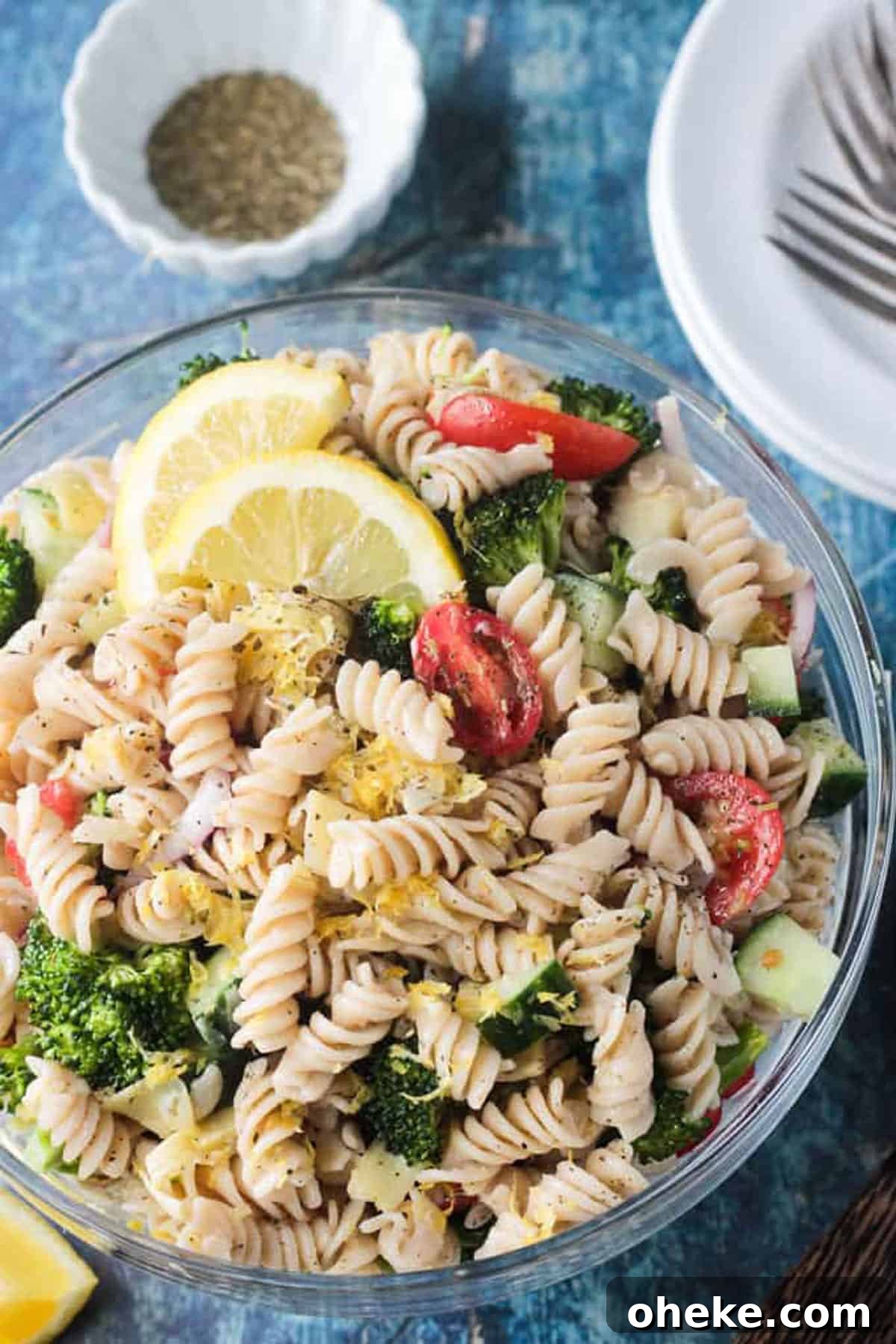 Zesty Lemon & Artichoke Pasta Salad Recipe for Summer 6 Close up of lemon zest on top of rotini pasta.