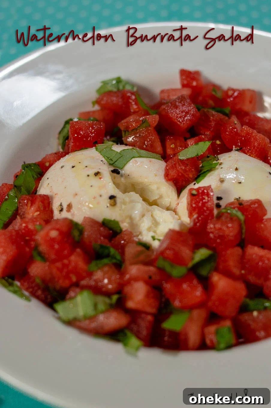 Refreshing Watermelon and Burrata Salad with Basil and Balsamic 5 Two balls of burrata with watermelon around them