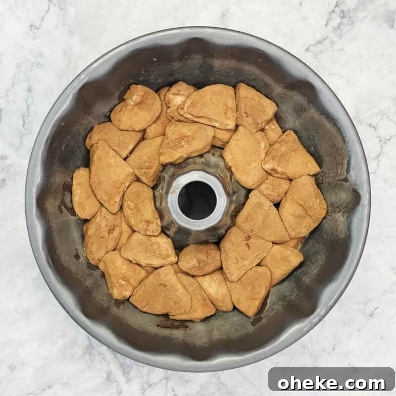 Chocolate Pretzel Biscuit Monkey Bread Recipe 6 Add half the biscuit pieces to a greased bundt pan.
