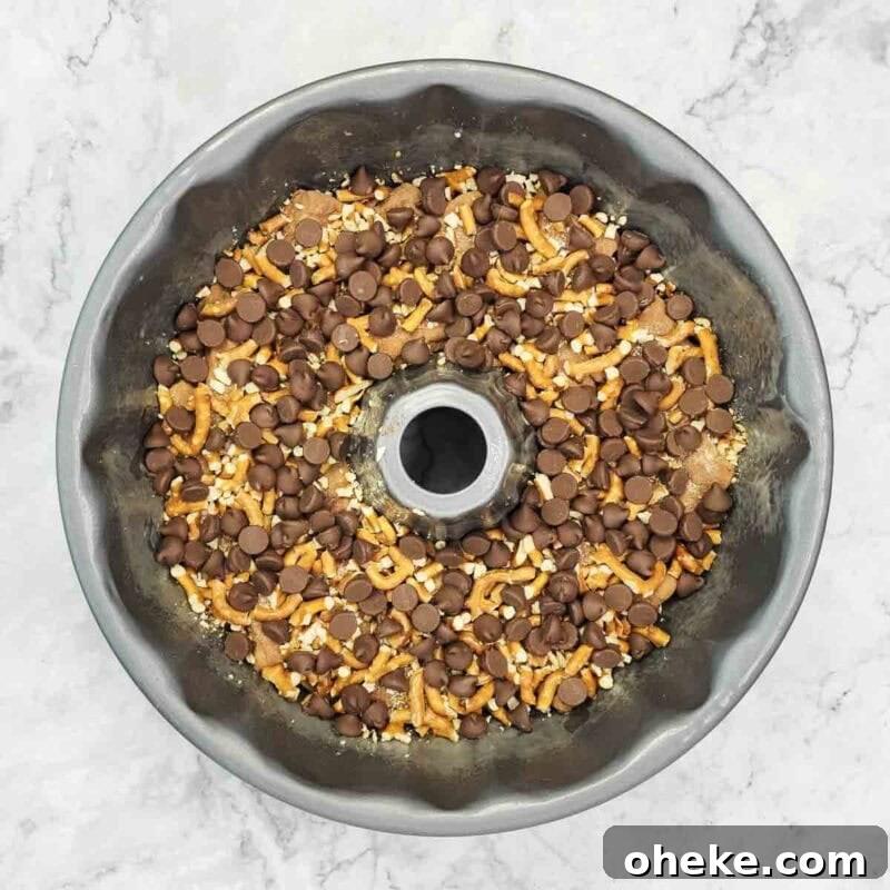 Chocolate Pretzel Biscuit Monkey Bread Recipe 7 Add pretzels and chocolate chips as a middle layer.