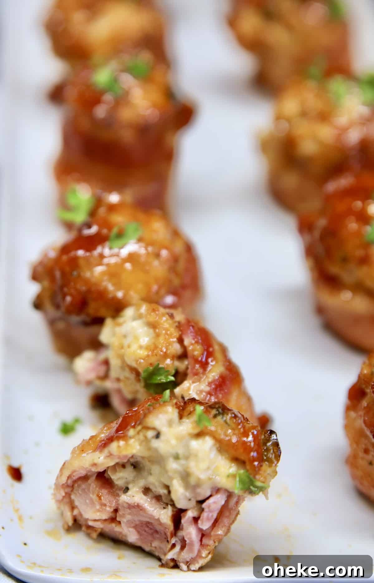 Chicken popper pig shot cut in half on a platter.