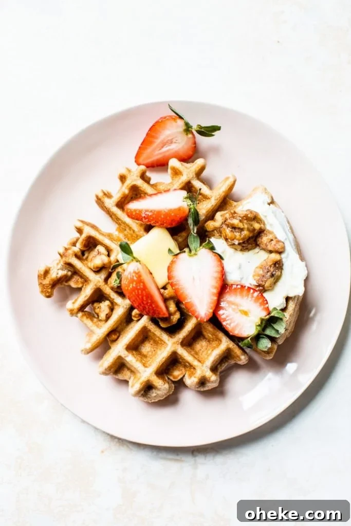 Fluffy Whole Wheat Waffles that are made with whole wheat flour, coconut oil and maple syrup for a healthier breakfast option | thealmondeater.com