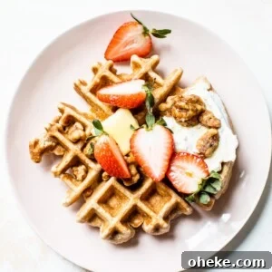 Fluffy Whole Wheat Waffles that are made with whole wheat flour, coconut oil and maple syrup for a healthier breakfast option | thealmondeater.com