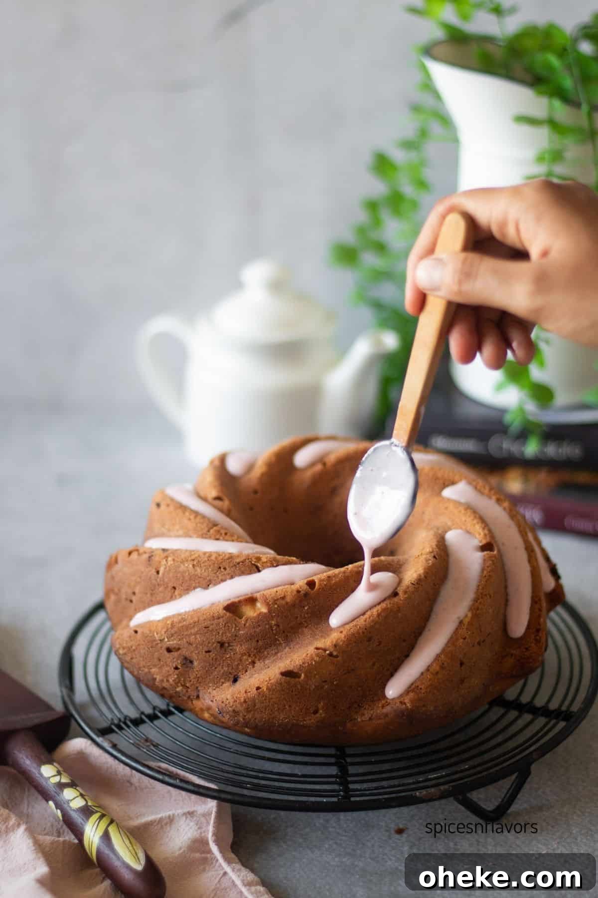 Fresh Strawberry Glaze for Cakes — Quick Homemade Icing 7 pouring strawberry glaze over strawberry pound cake
