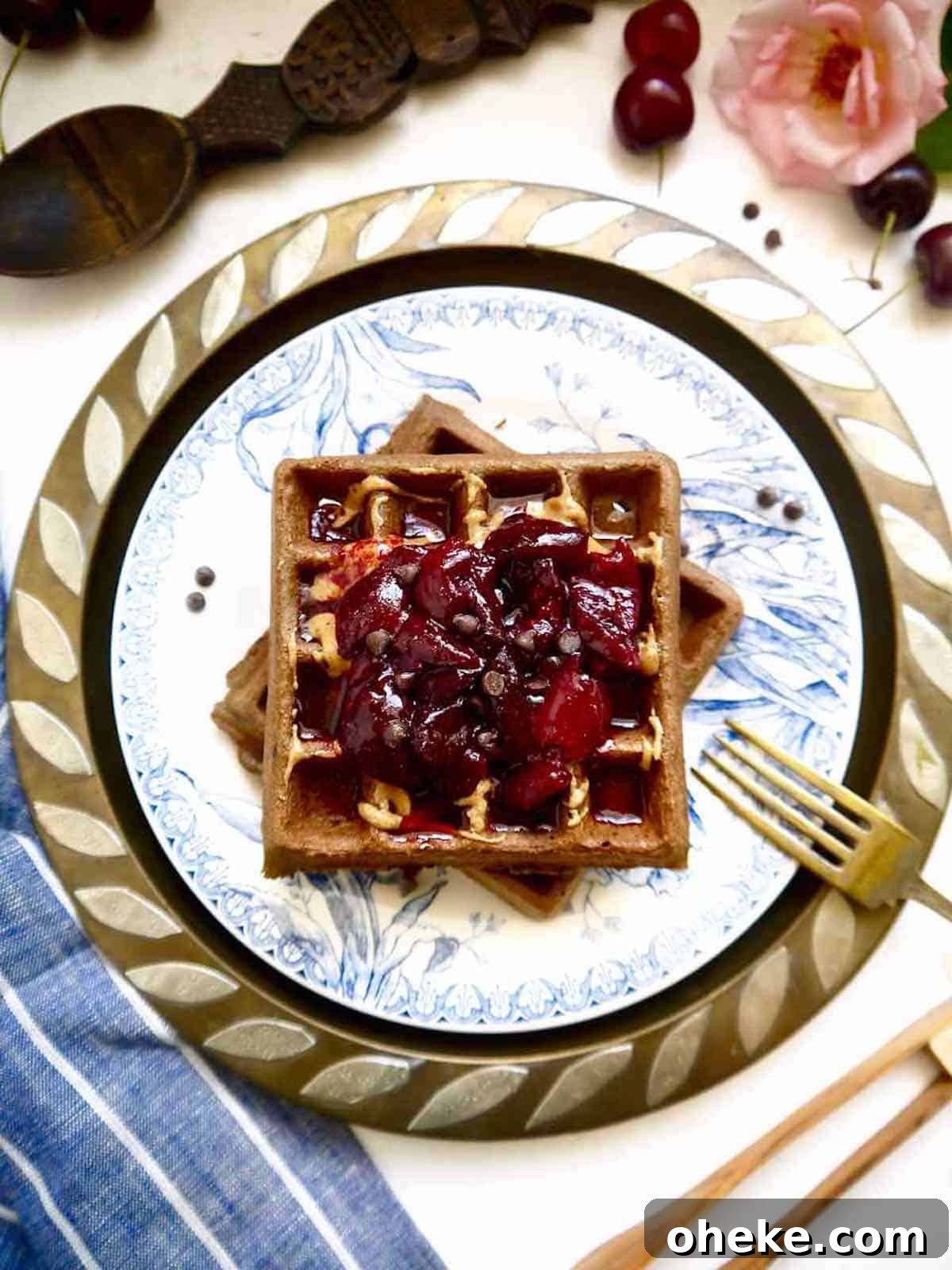 Gluten-Free Chocolate Cherry Waffles — Paleo Recipe 3 Gluten free chocolate waffles with cherry compote on top.