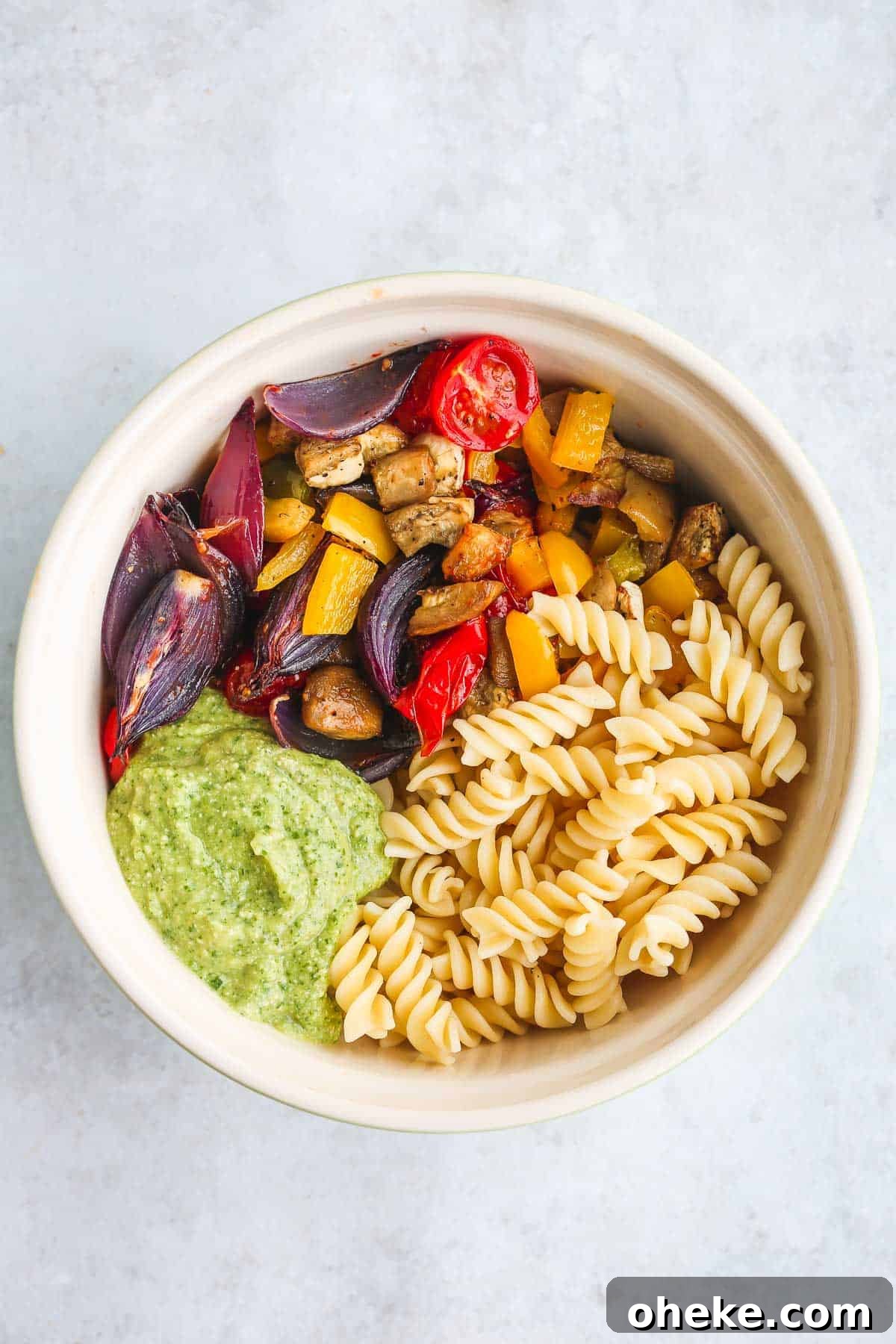 Vibrant Vegan Pasta Salad with Mediterranean Veggies and Herbs 4 The salad mixed with avocado cilantro dressing