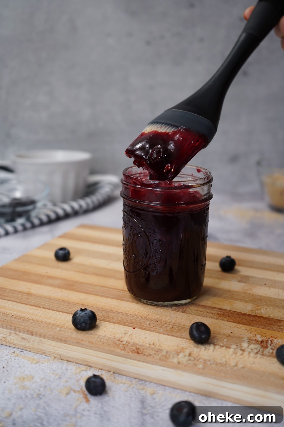 Tangy Blueberry BBQ Sauce Recipe for Grilling & Glazing 3 Mason jar filled with blueberry bbq sauce