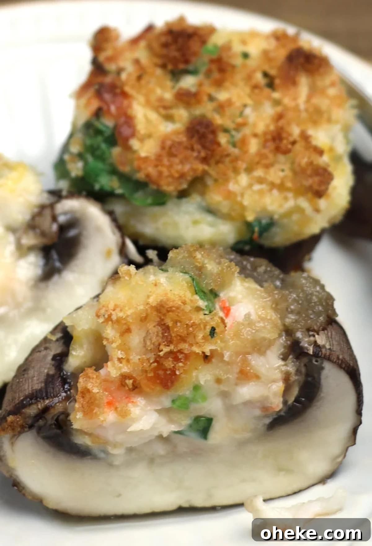 Sliced stuffed mushroom with shrimp and topped with breadcrumbs.