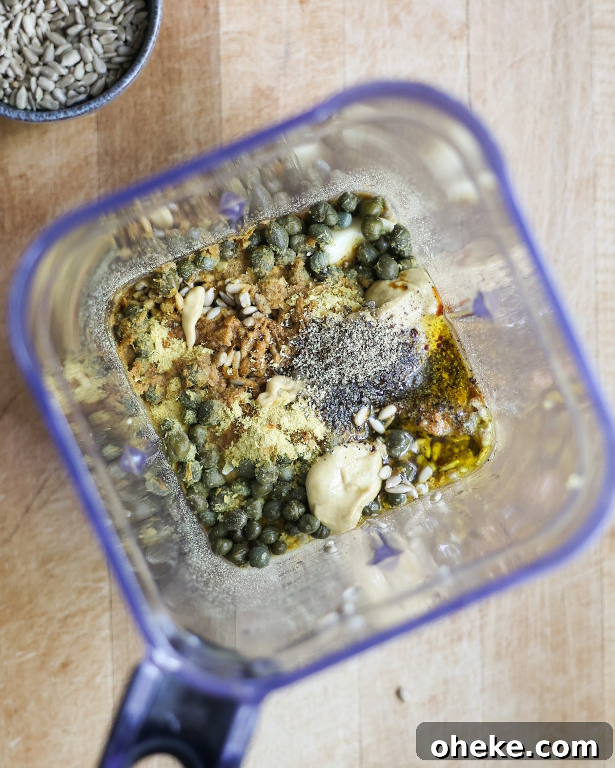 Creamy Vegan Caesar Dressing Recipe for Salads and Sandwiches 4 overhead of vegan caesar salad ingredients in a blender
