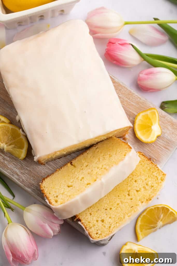 Ultimate Gluten-Free Lemon Cake Recipe — Moist & Zesty 2 Overhead view of gluten-free lemon cake, with 2 slices laying next to the end of the loaf.