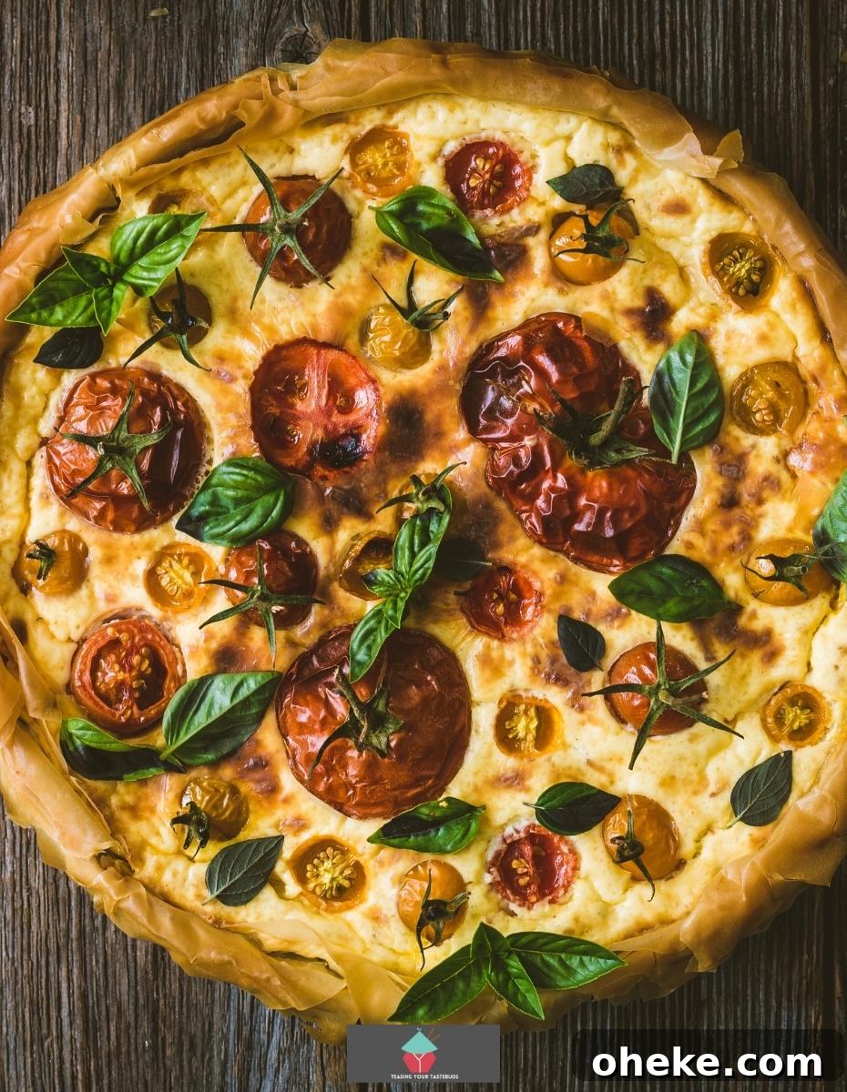Spinach and Feta Galette, a delicious open pastry savoury pie filled with Greek feta cheese creamy spinach and tomatoes, then baked until set. Great served warm or chilled.