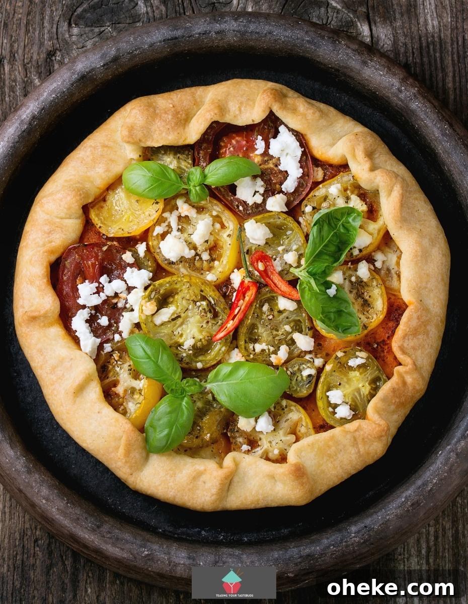 Spinach and Feta Galette, a delicious open pastry savoury pie filled with Greek feta cheese creamy spinach and tomatoes, then baked until set. Great served warm or chilled.