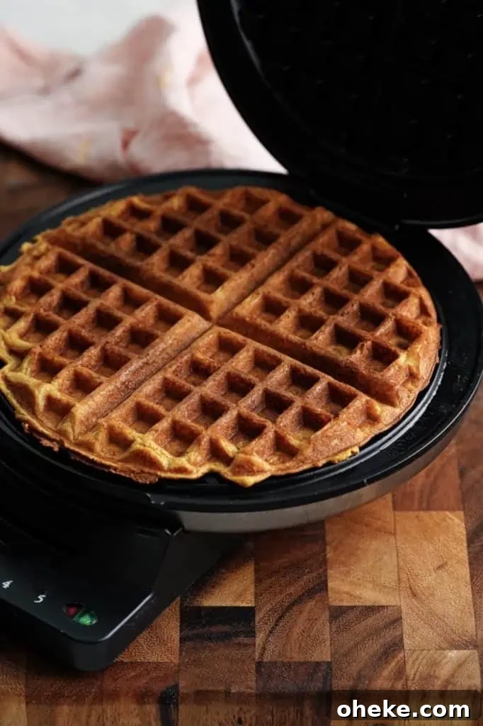 buttermilk pumpkin spice waffles in waffle maker.