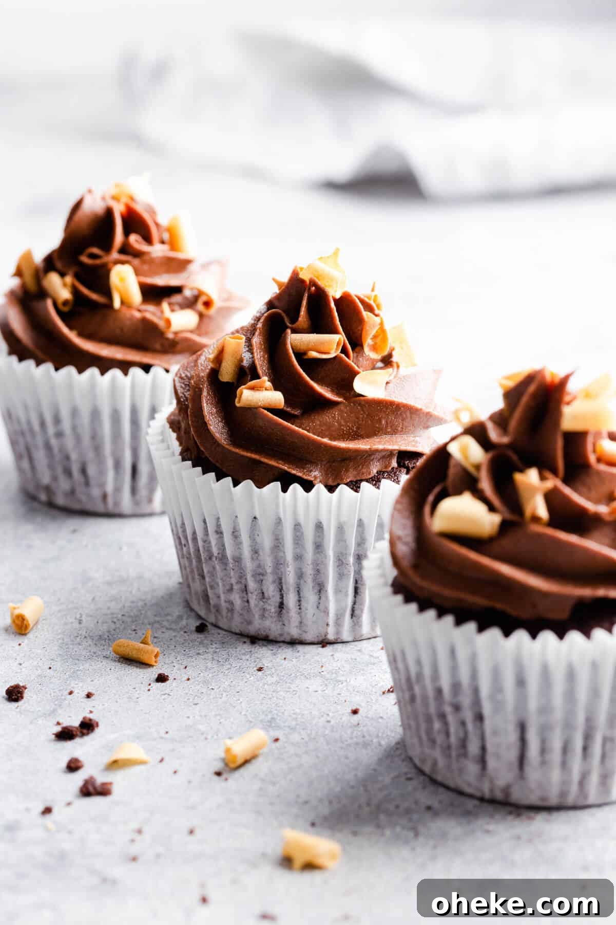 side angle photo of 3 cupcakes with only one of them in focus
