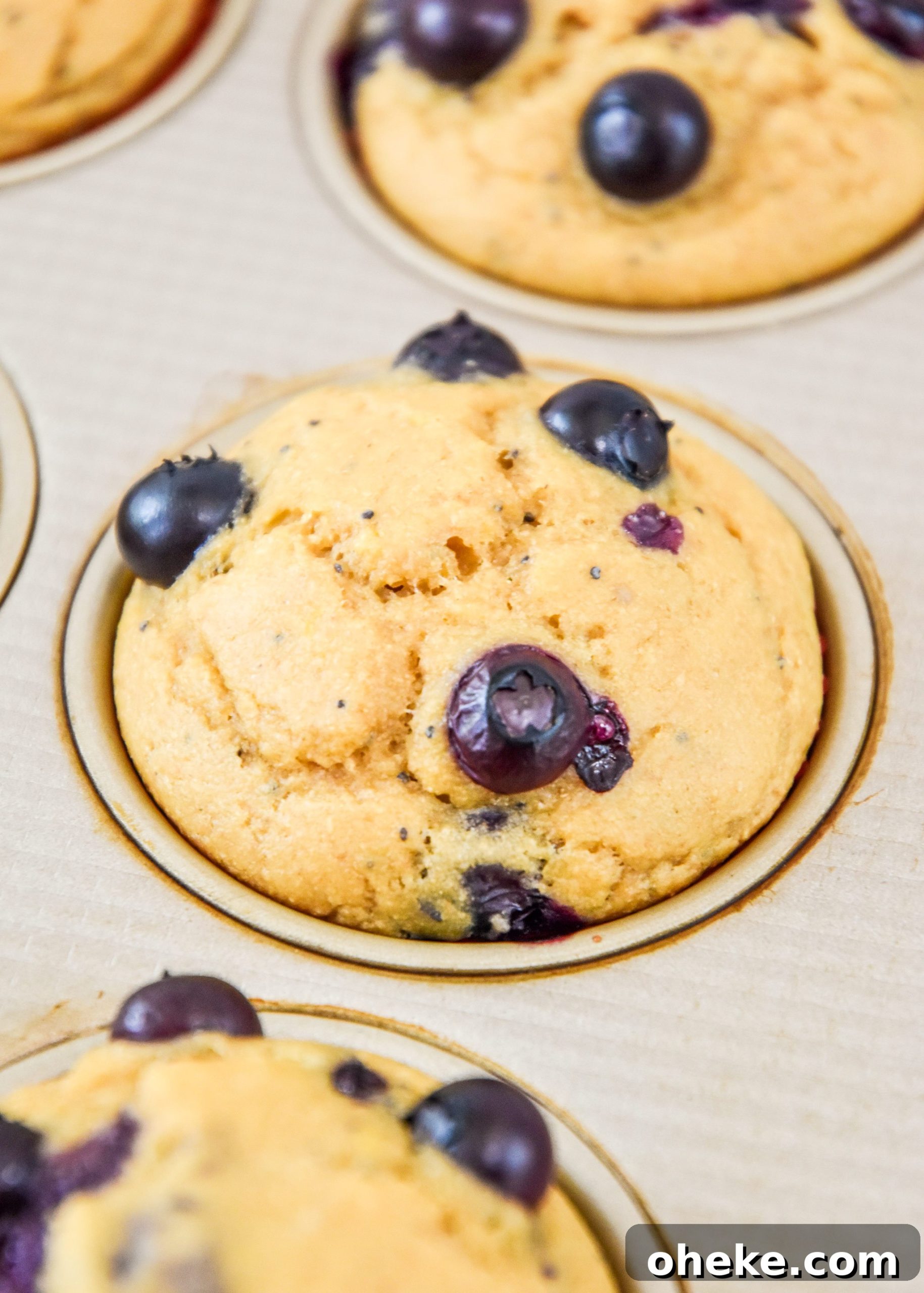 close up of cooked blueberry lemon pancake mix muffins.