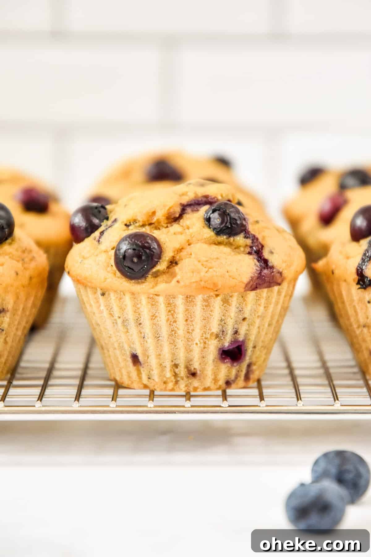 side view of muffins on a cooling rack.