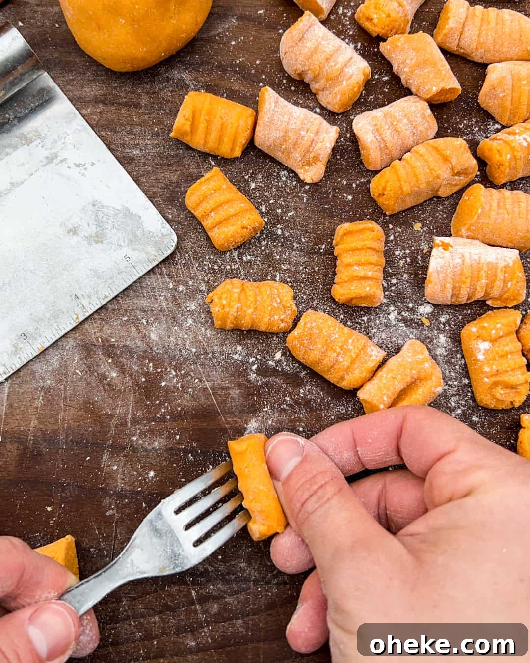 Sweet Potato Gnocchi with Garlic Mushrooms (Gluten-Free) 4 Sweet potato gnocchi being formed with the tines of a fork