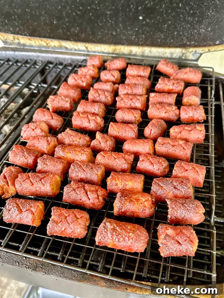 Carolina Gold BBQ Burnt Ends Made from Hot Dogs 2 hot dogs with a cross shape on a grill