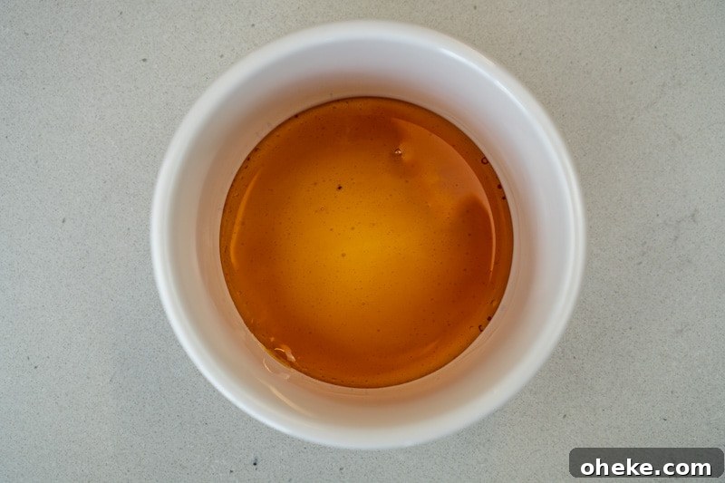 Pouring the caramel into the ramekin