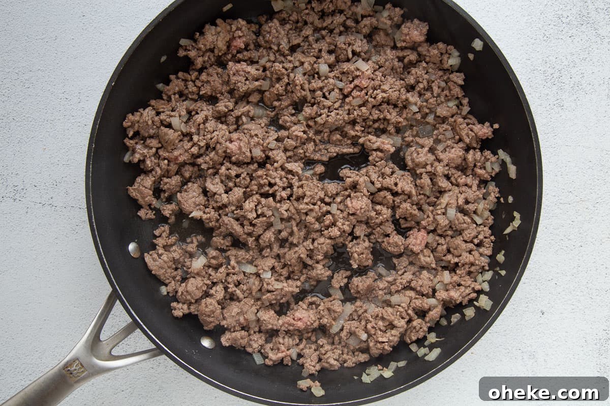 ground beef and chopped onion in a large skillet.