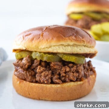 old fashioned sloppy joes meat on a brioche bun with pickles.
