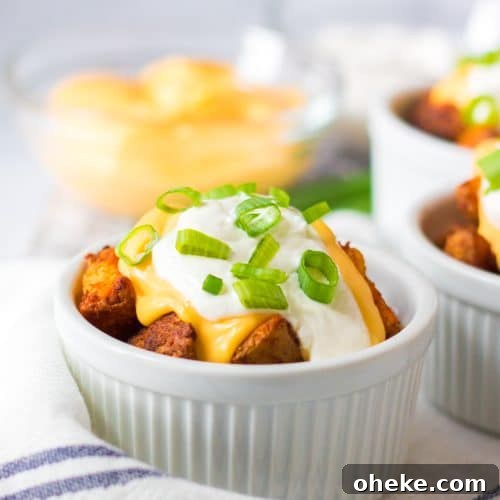 cheesy air fryer potatoes in a white ramekin