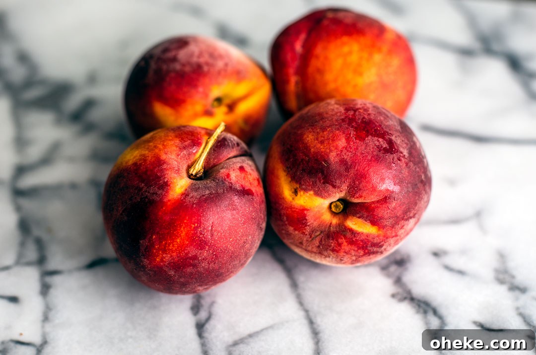 Peaches on marble countertop.