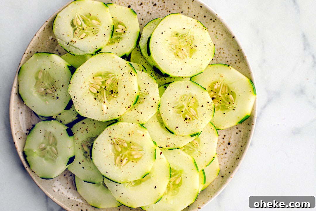 Plate full of peppered cucumber slices.