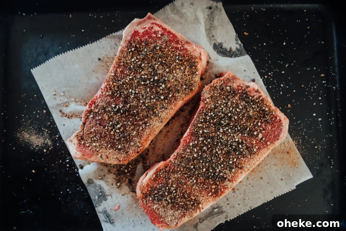 Steaks seasoned.