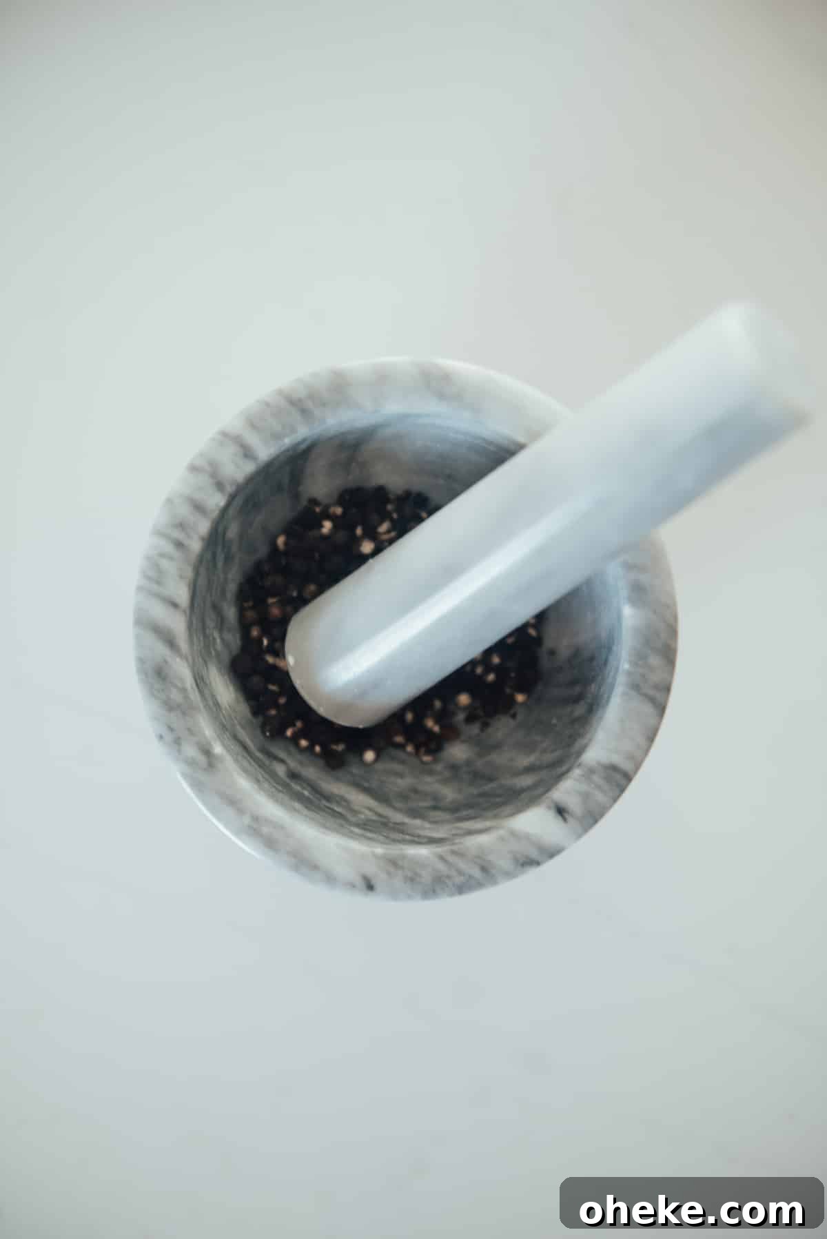 Peppercorns in mortar.