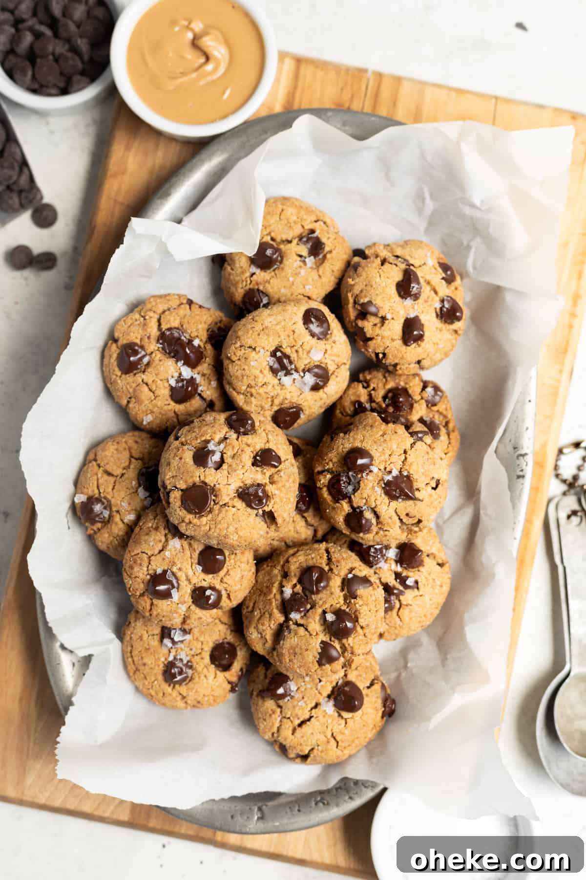 Gluten-Free Peanut Butter Chocolate Chip Cookies Recipe 2 healthy peanut butter chocolate chip cookies on tray