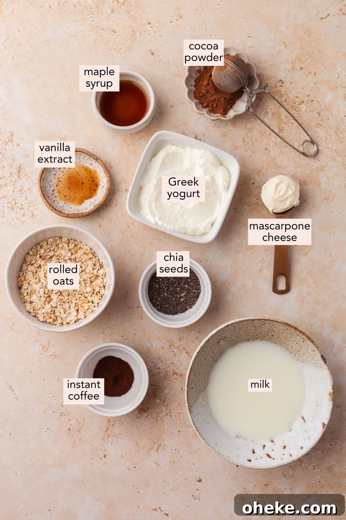 Based on the Italian coffee-infused dessert, these tiramisu overnight oats are a delicious, surprisingly nutritious way to start the day. Ingredients for tiramisu overnight oats on a countertop with labels.