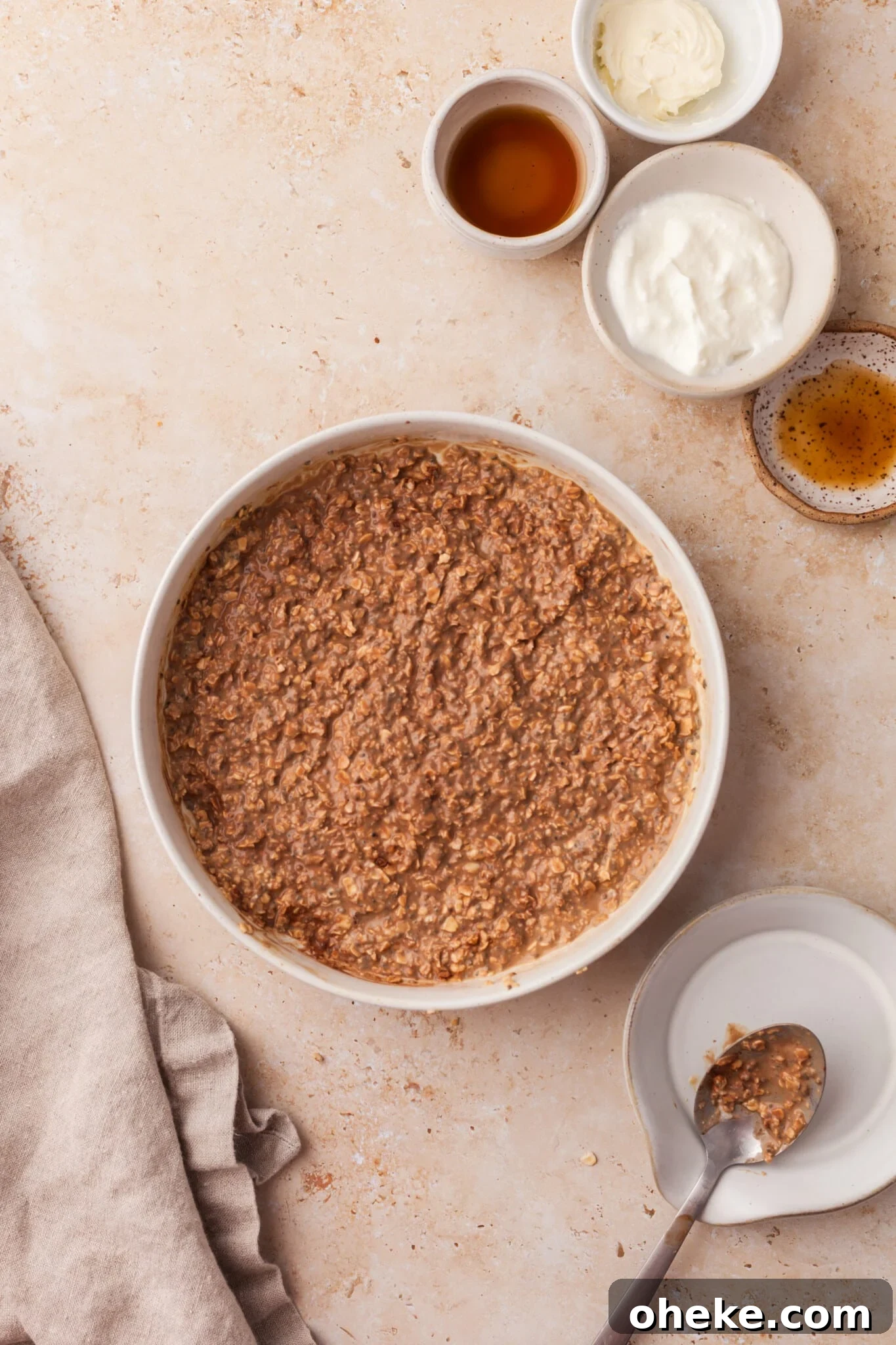 Based on the Italian coffee-infused dessert, these tiramisu overnight oats are a delicious, surprisingly nutritious way to start the day. Oats, Greek yogurt, milk, chia seeds, instant coffee, and maple syrup mixed together in a bowl.