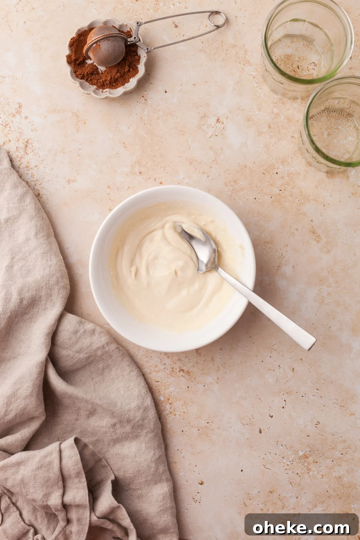 Based on the Italian coffee-infused dessert, these tiramisu overnight oats are a delicious, surprisingly nutritious way to start the day. Yogurt, maple syrup, vanilla, and mascarpone mixed together in a bowl.