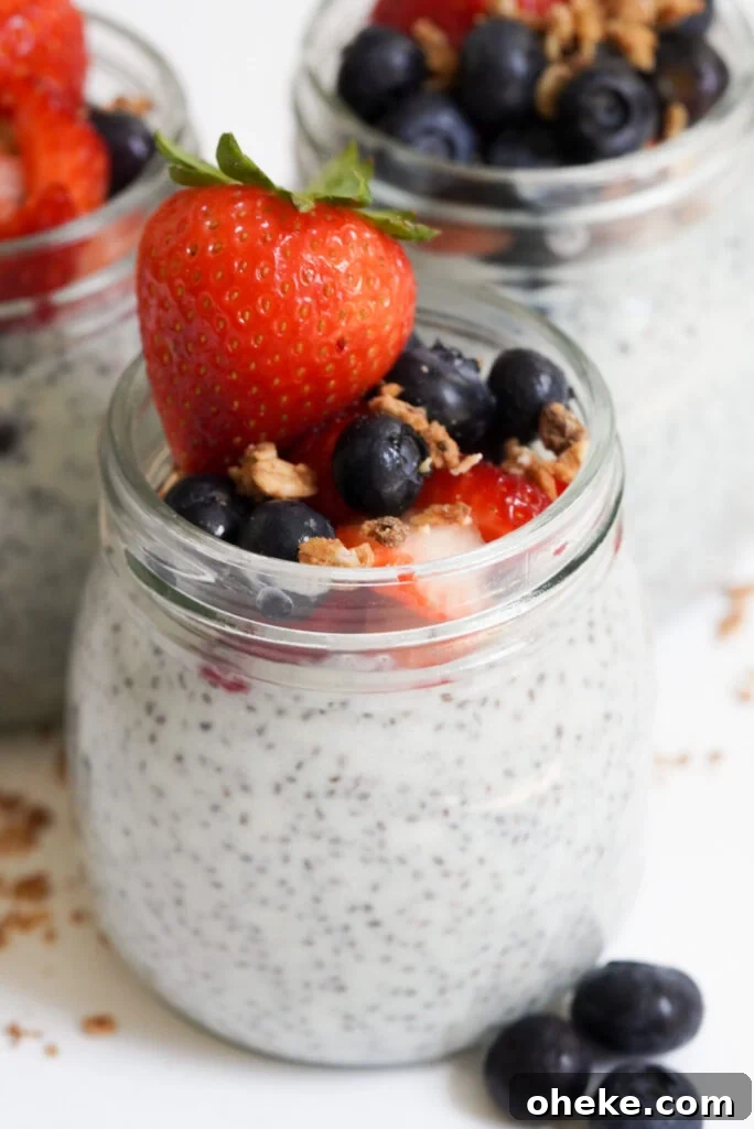 High-Protein Chia Pudding Recipe for Muscle Fuel 11 chia seed pudding protein jars with berries and granola.