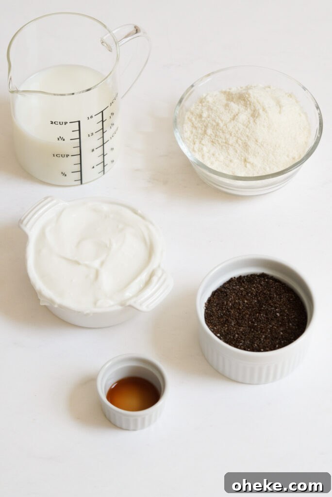 High-Protein Chia Pudding Recipe for Muscle Fuel 4 ingredients for making protein chia seed pudding measured out into bowls on a white table.
