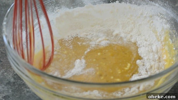 Paleo Lemon Bars with Almond-Coconut Crust Recipe 6 Mixing the lemon topping in a bowl.