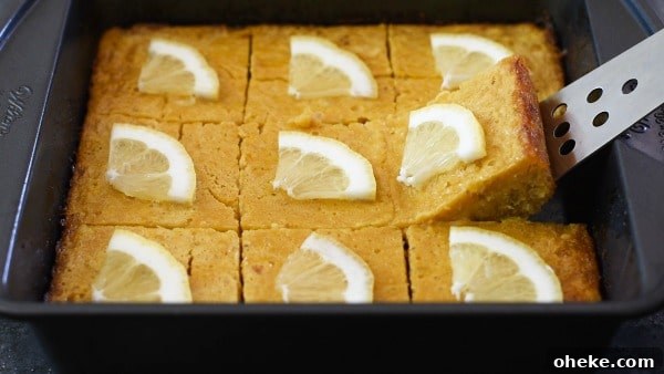 Paleo Lemon Bars with Almond-Coconut Crust Recipe 8 Cutting out a lemon square from the pan.