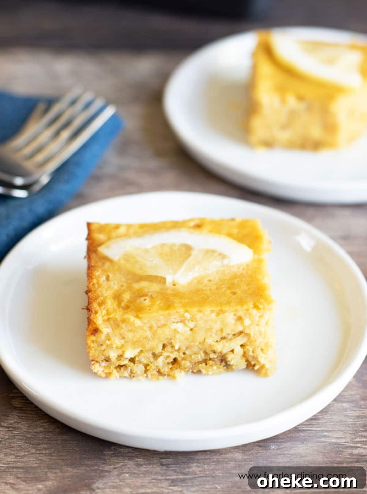 Paleo Lemon Bars with Almond-Coconut Crust Recipe 9 A close up picture of the grain-free lemon bar on a plate.