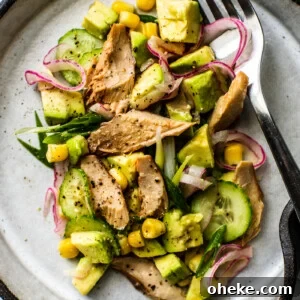 Overhead closeup of plate full of avocado and mackerel salad.