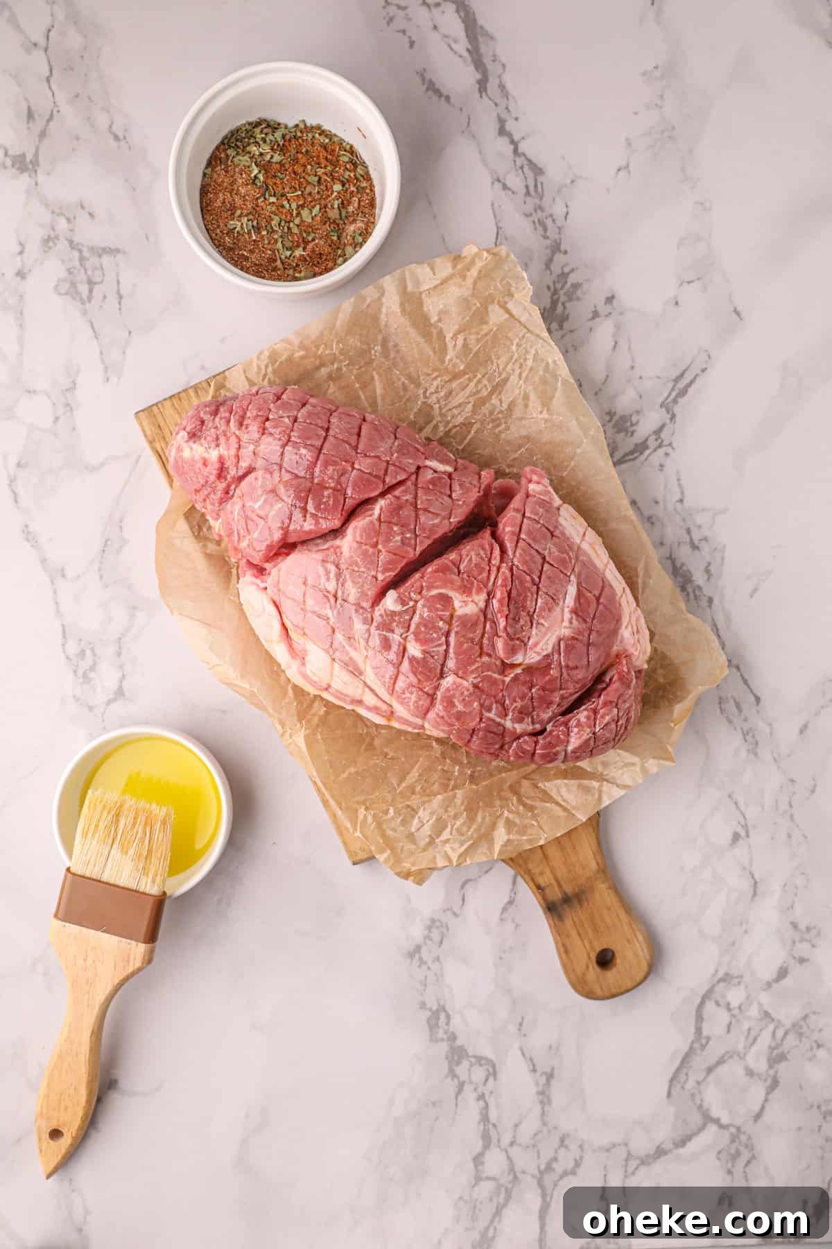 Brushing Olive Oil on Pork for Smoked Pork Carnitas Recipe